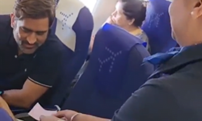 MS Dhoni recieves chocolates from Air Hostess