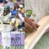 Usman Khawaja removes sticker from bat